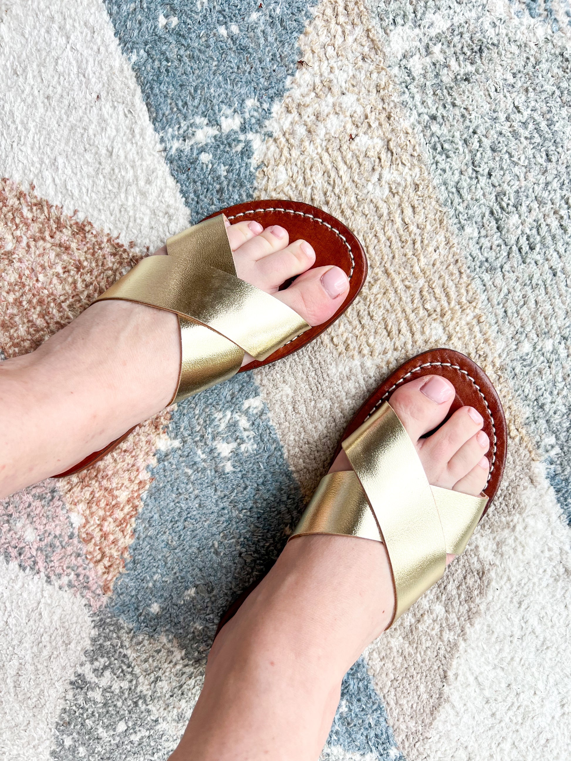 Authentic Idrissi & Burch Moroccan handmade gold leather sandals with decorative stitching.