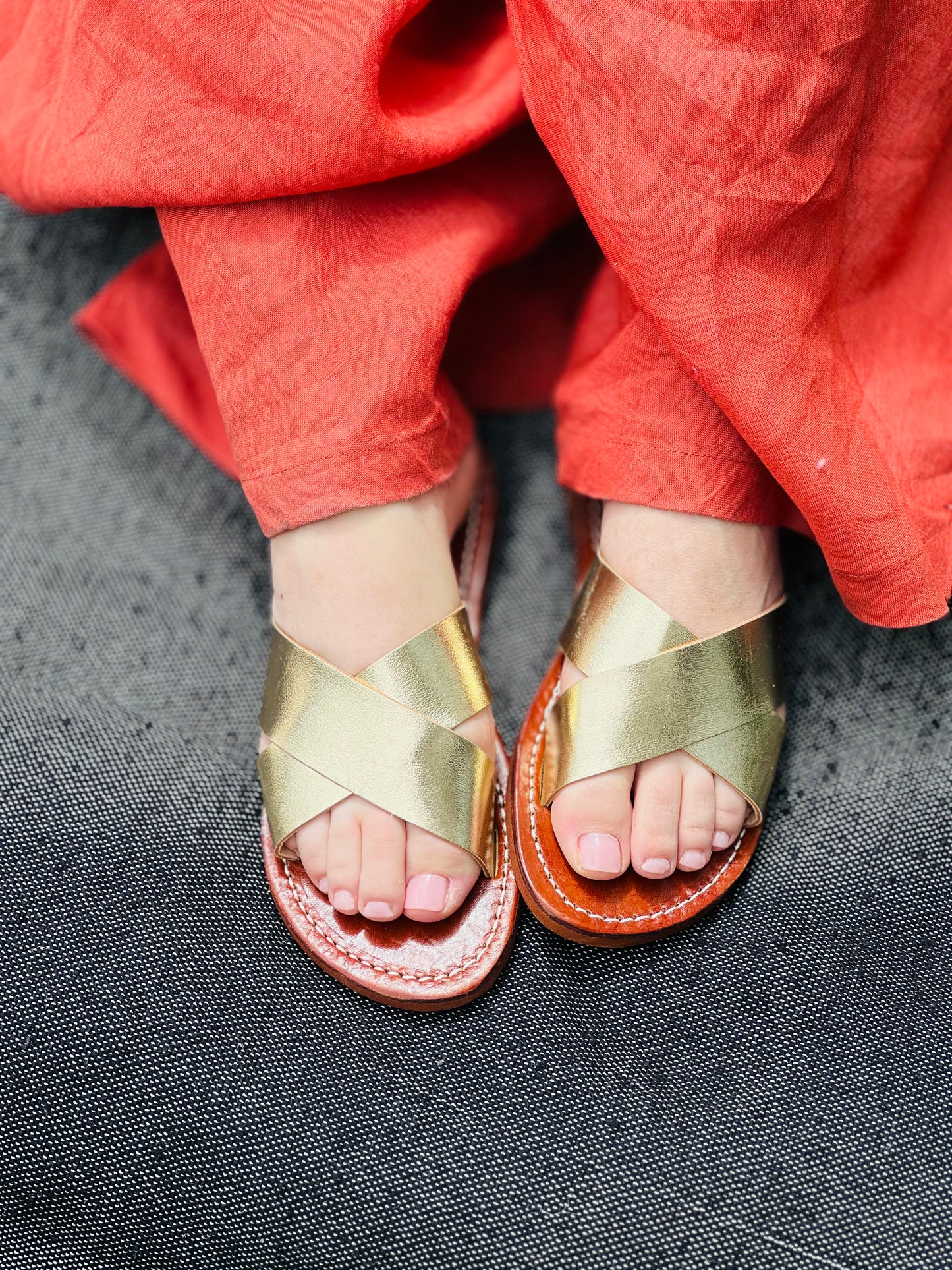 Authentic Idrissi & Burch Moroccan handmade gold leather sandals with decorative stitching.